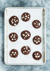 Eggless White Chip Chocolate Cookies on a baking cookie sheet