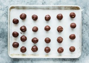 egg-free chocolate cookie dough balls in a baking sheet