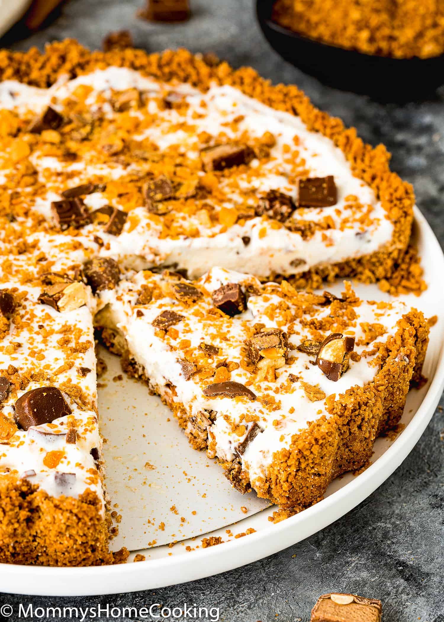 sliced Easy Eggless Candy Ice Cream Pie over a white plate. 