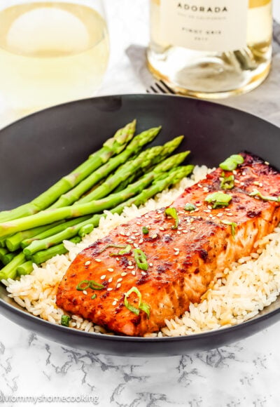 quick and easy baked teriyaki salmon in a plate with rice and asparagus.