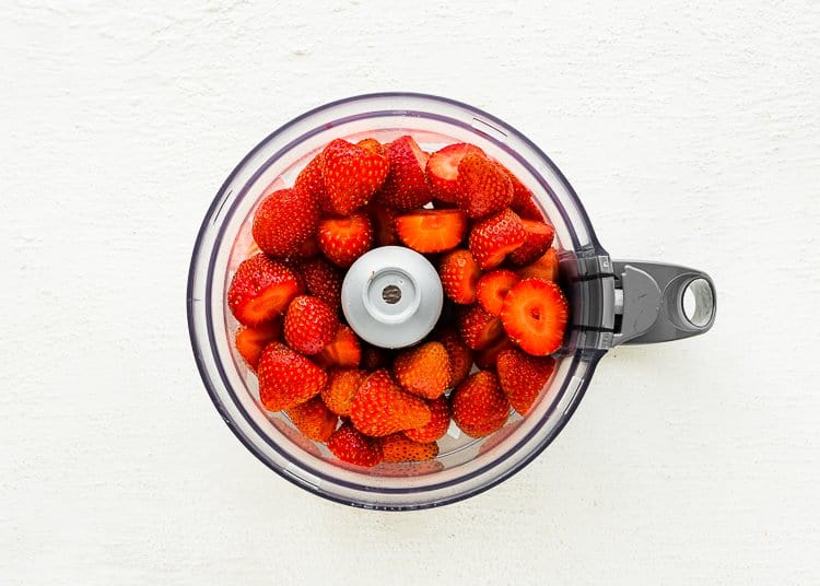 Strawberries in a food processor. 