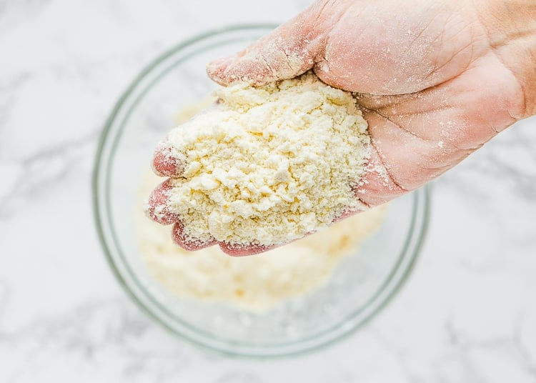 a hand showing how the scone crumbs should look. 