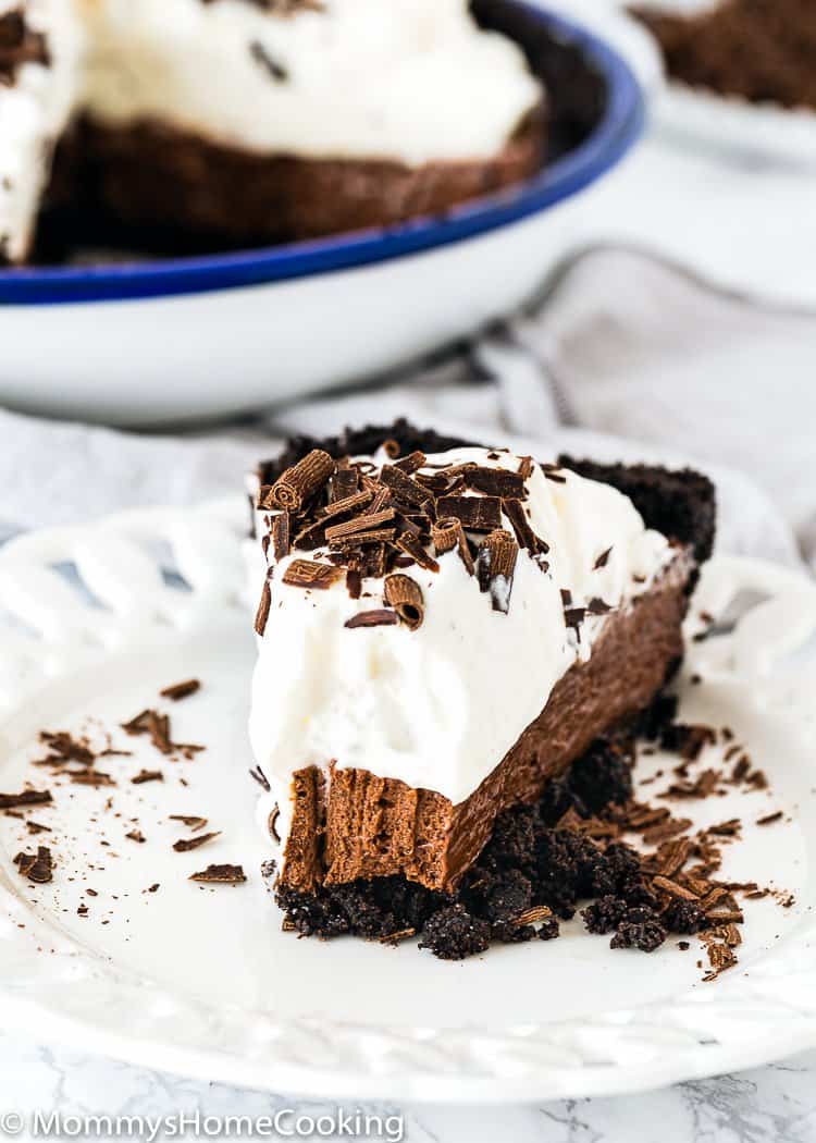 slice of No-Bake Eggless Chocolate Cream Pie in a white plate showing inside texture