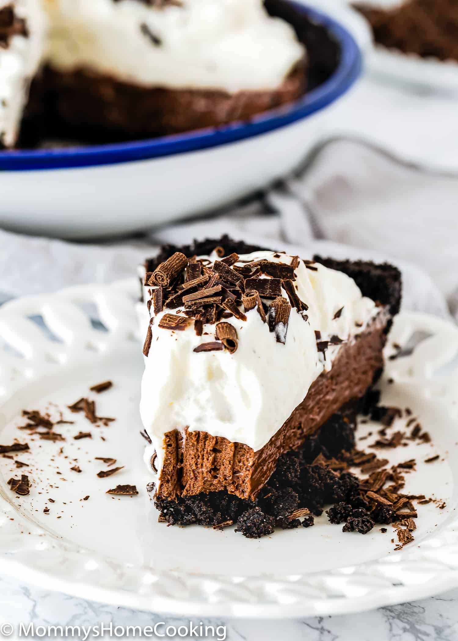 slice of No-Bake Eggless Chocolate Cream Pie on a plate.