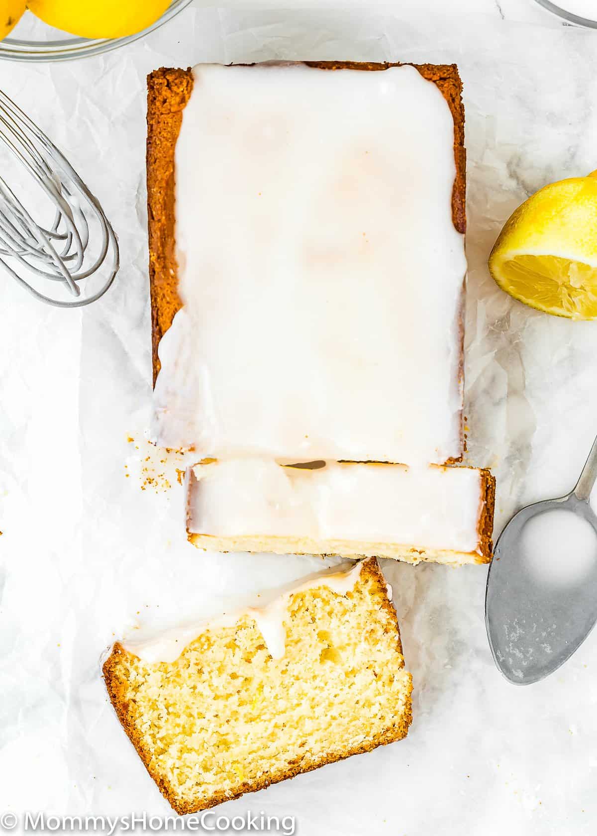 overhead view of a sliced Eggless Lemon Pound Cake with glaze