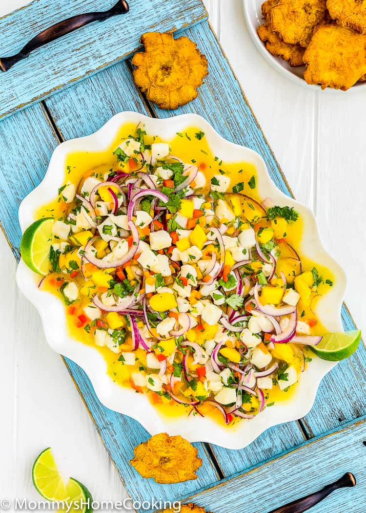 Easy Fish and Mango Ceviche over a serving plate with homemade tostones