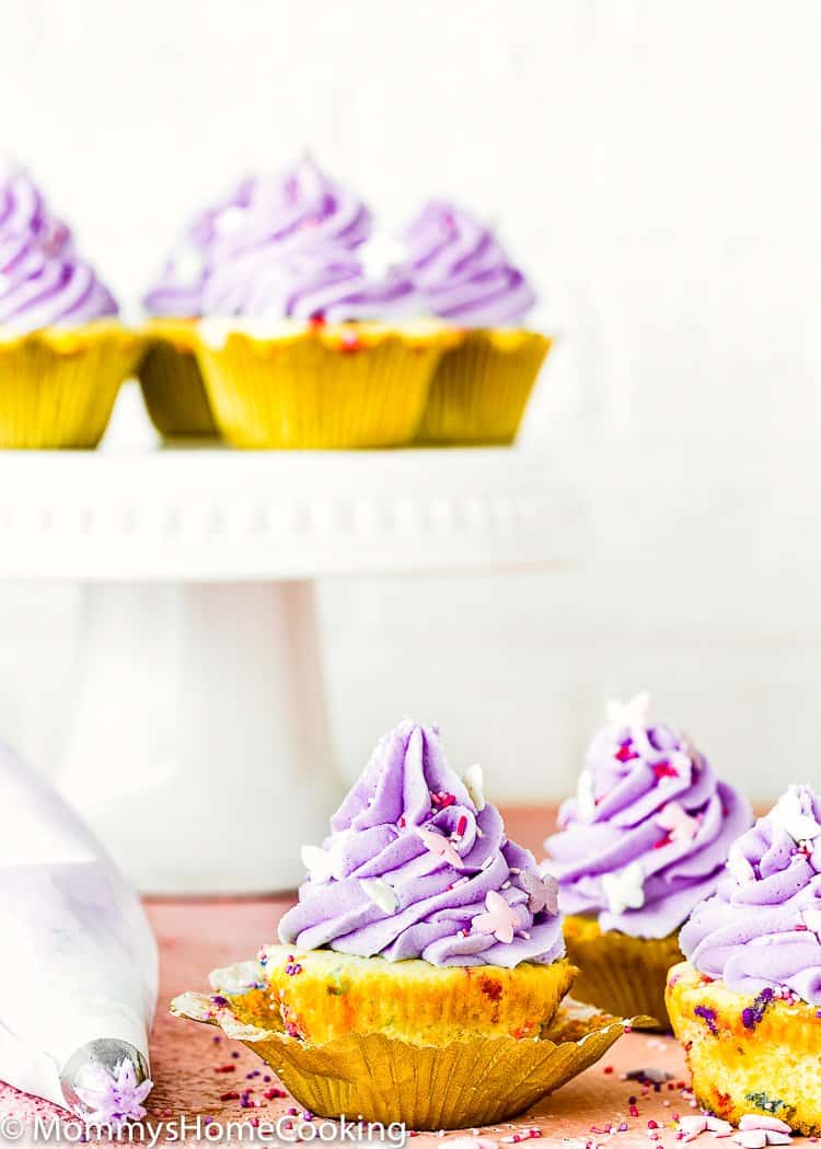 Eggless Confetti Cupcakes with purple buttercream and sprinkles
