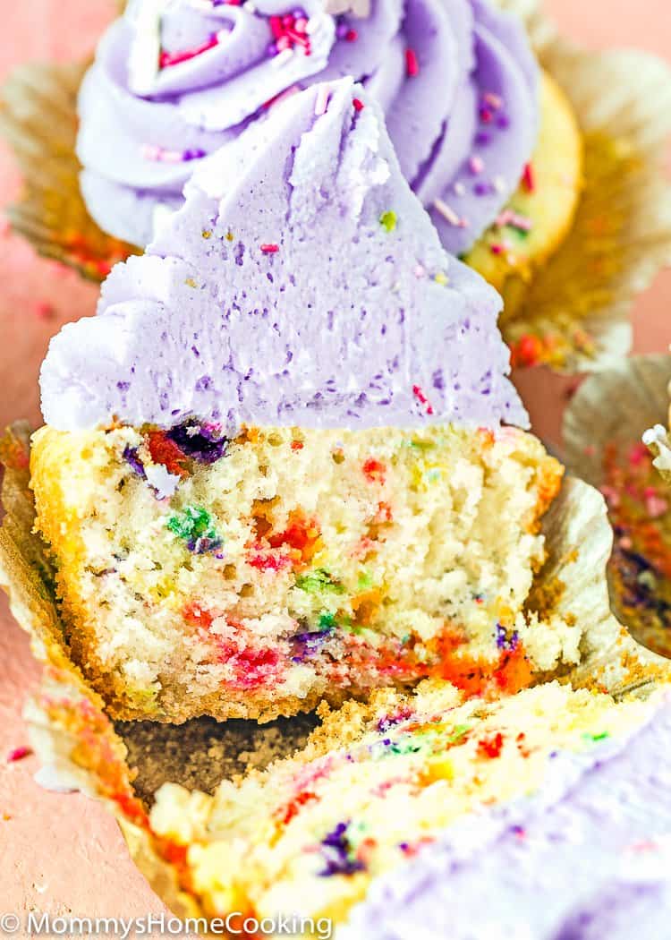 eggless confetti cupcake cut in half showing fluffy inside texture