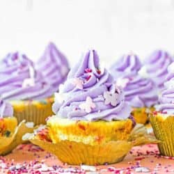 easy Eggless Confetti Cupcakes with purple buttercream and sprinkles