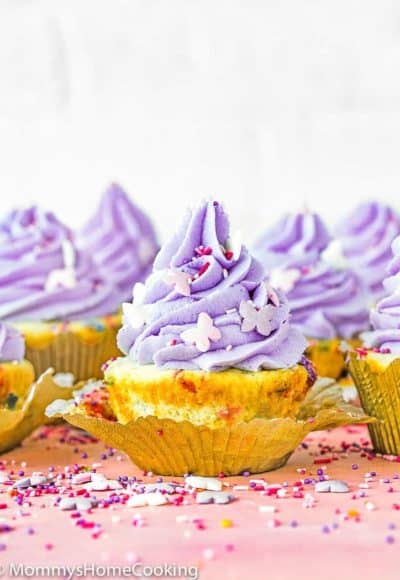 easy Eggless Confetti Cupcakes with purple buttercream and sprinkles