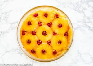 overhead view of a Eggless Pineapple Upside Down Cake on a plate