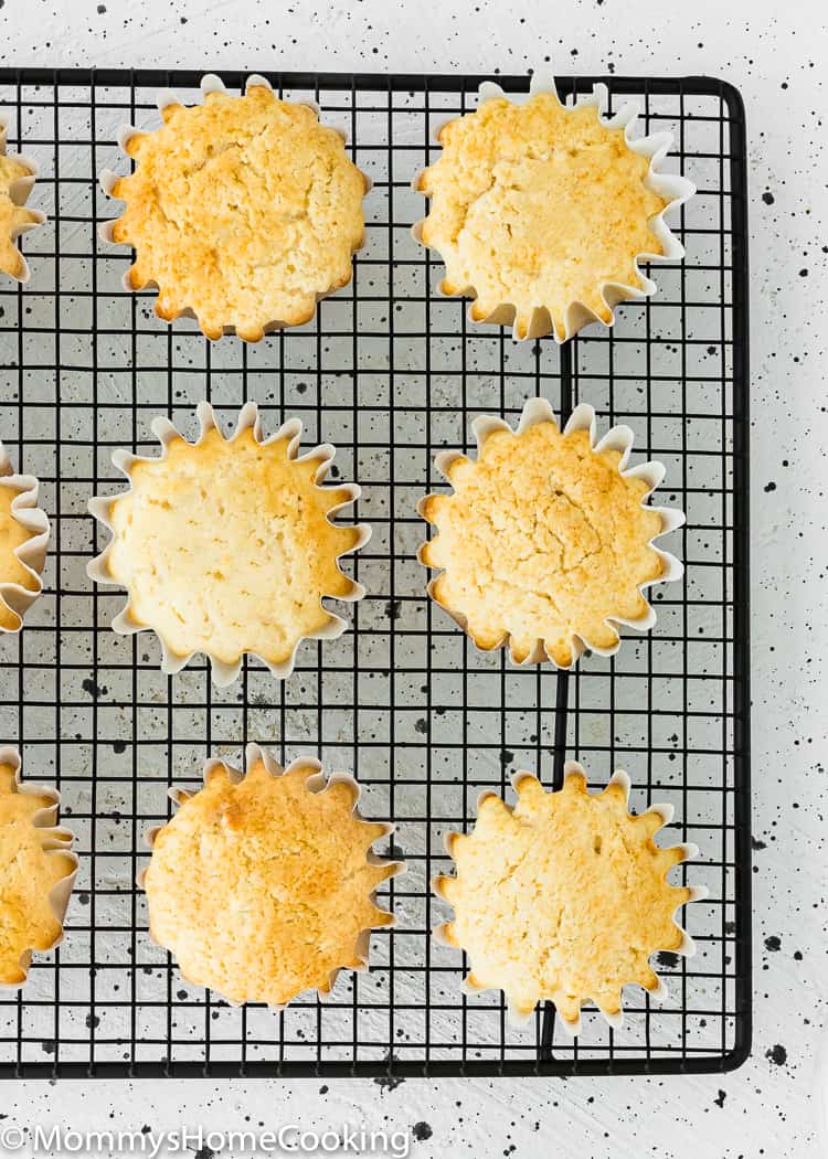 eggless vanilla cupcakes over a cooling rack. 