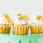 Eggless Lemon Meringue Cupcakes on a cake stand.