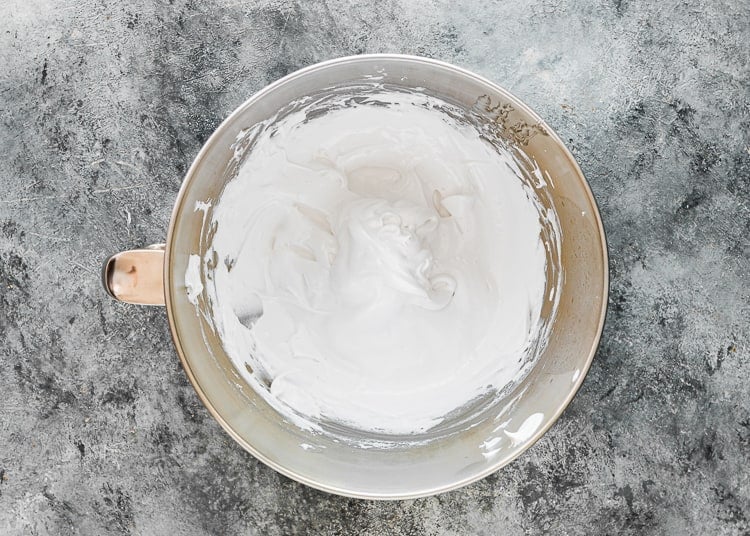 Homemade Eggless Marshmallow Fluff in a mixing bowl. 