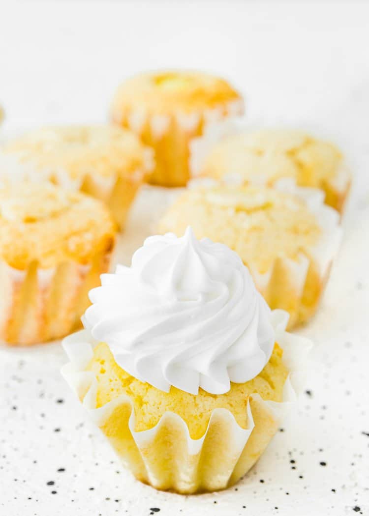 Eggless Lemon Meringue Cupcakes over a white surface. 
