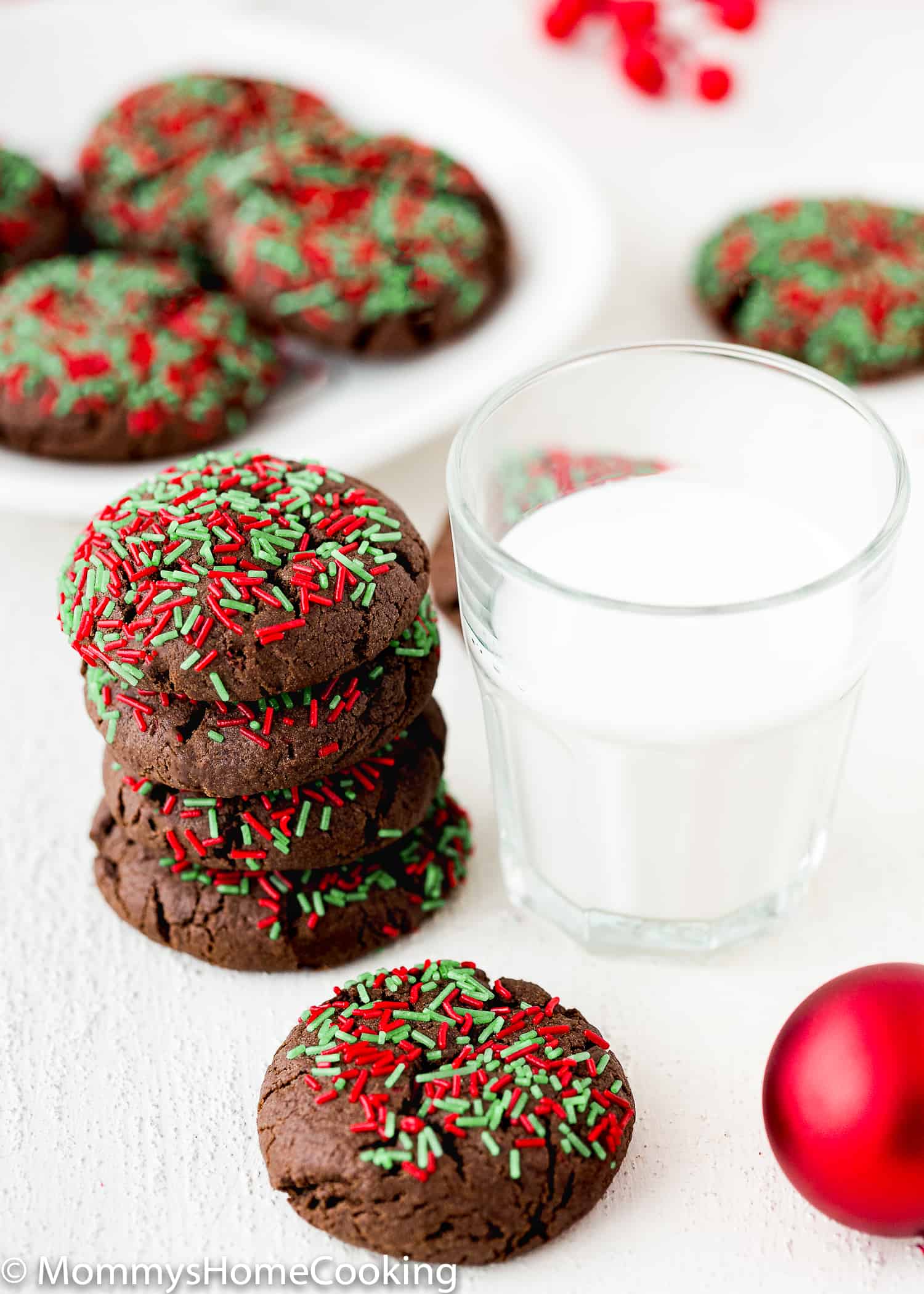 stack of  Easy Eggless Cake Mix Christmas Cookies with a glass of milk.