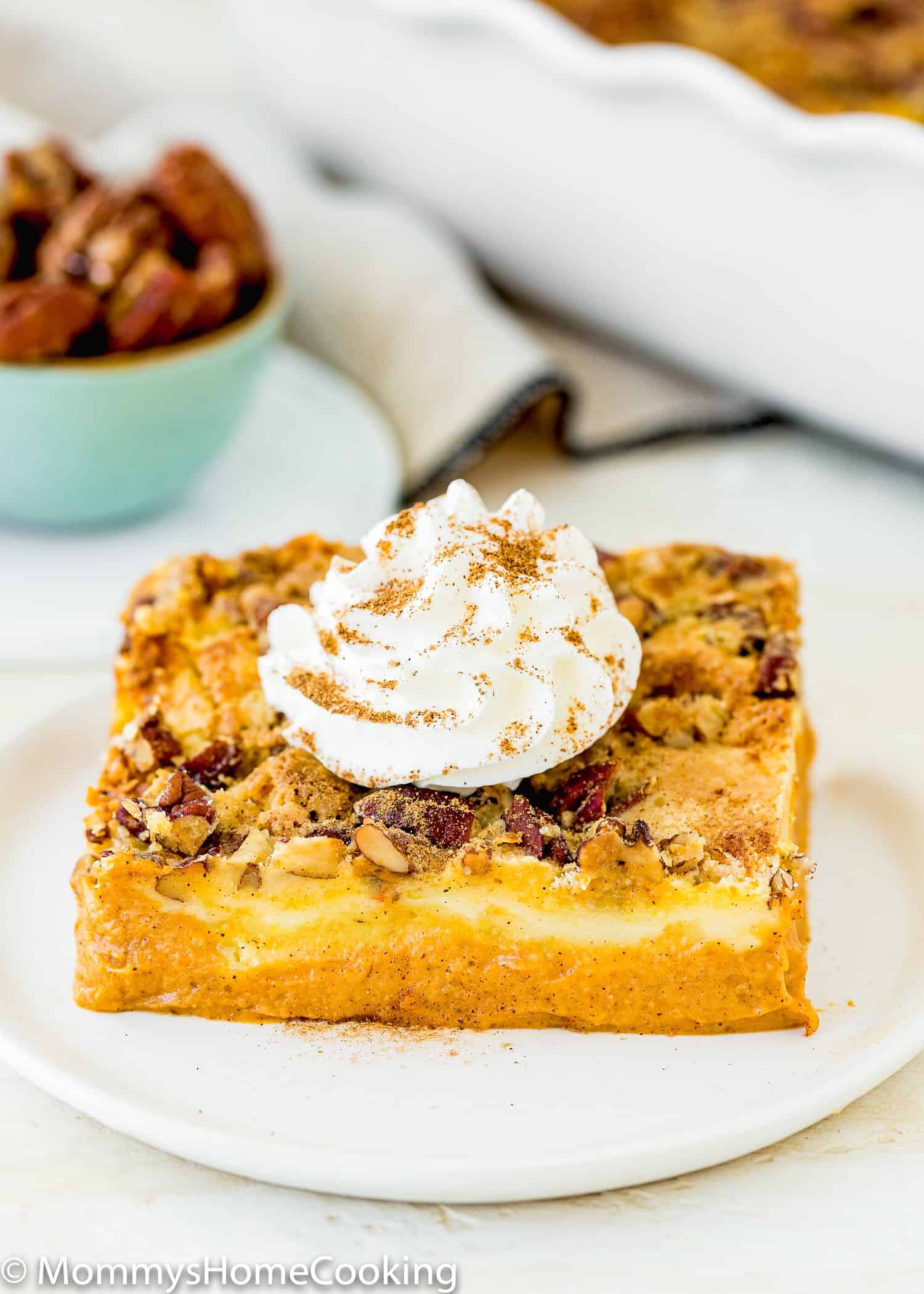 Eggless Pumpkin Dump Cake on a plate with whipped cream