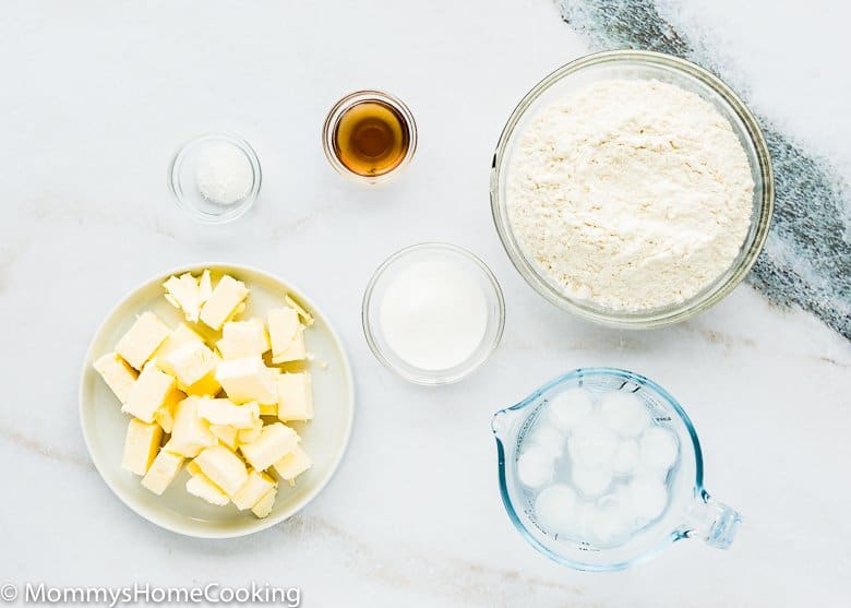 ingredients to MAKE PIE CRUST FROM SCRATCH over a white surface