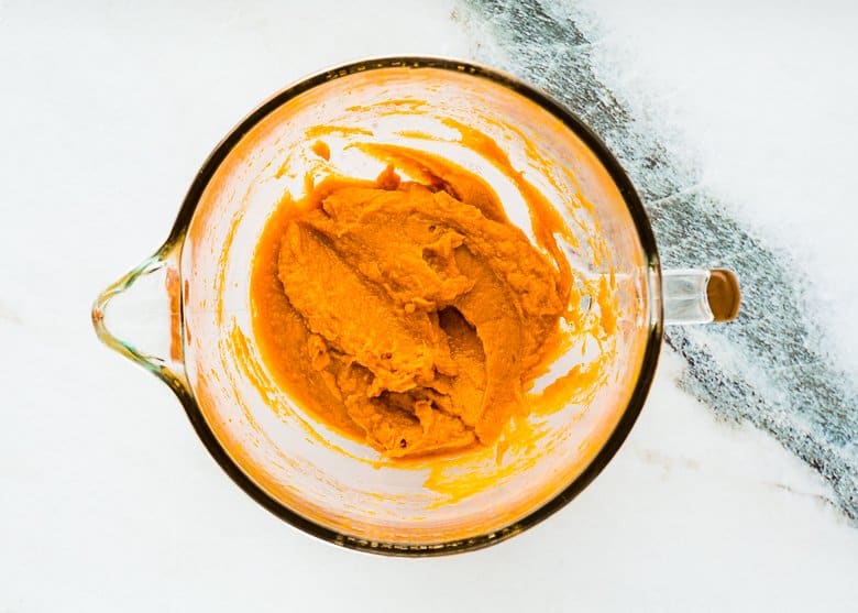 mashed sweet potato in a stand mixer bowl.