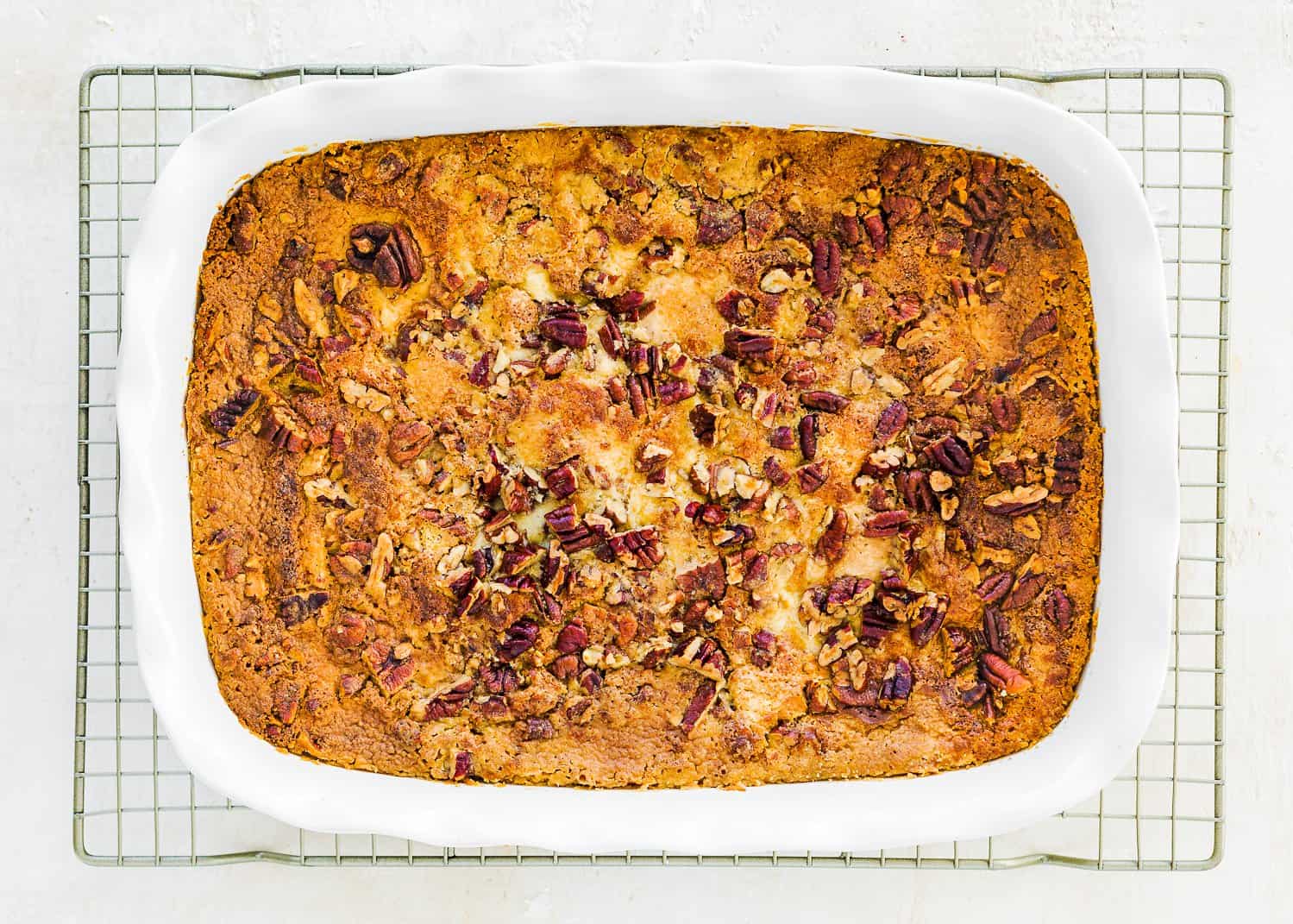 bake eggless dump cake in a baking dish over a cooling rack. 