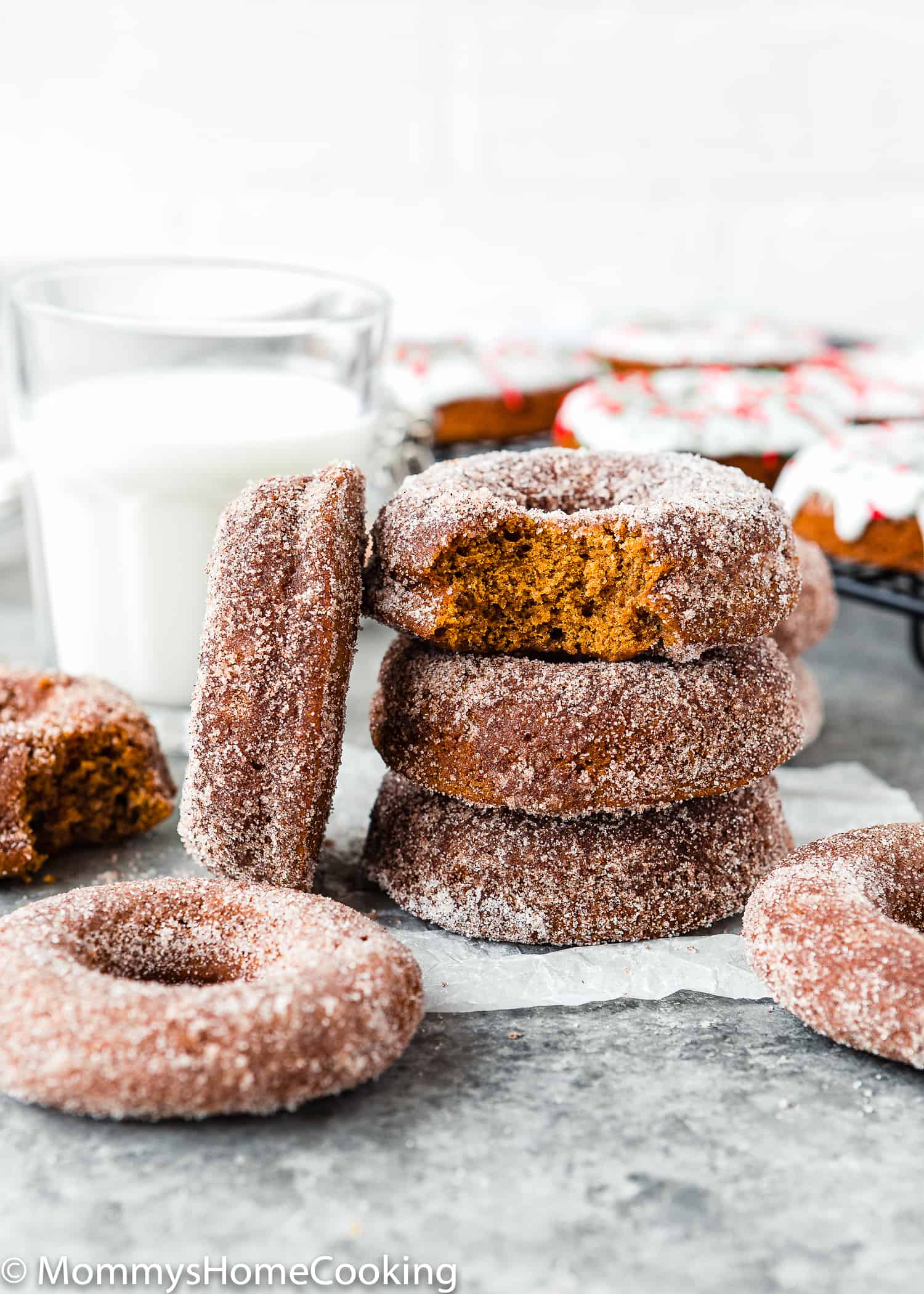 Eggless Gingerbread Donuts stack with a glass of milk