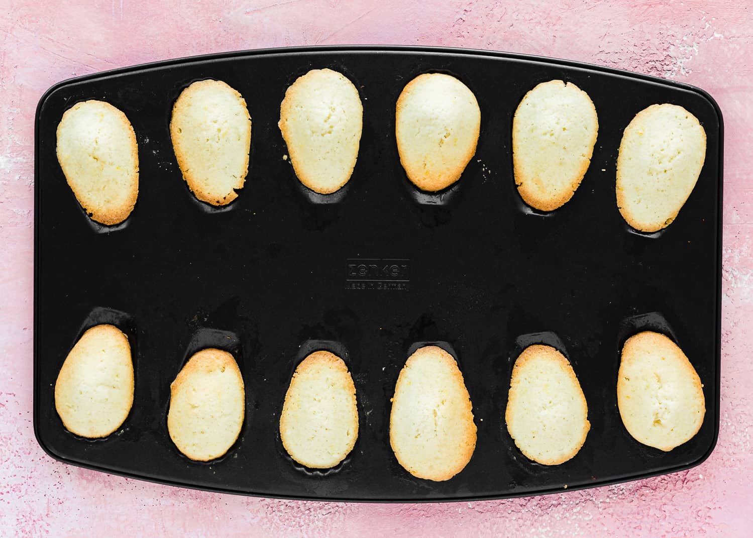baked eggless madeleines in a baking pan. 