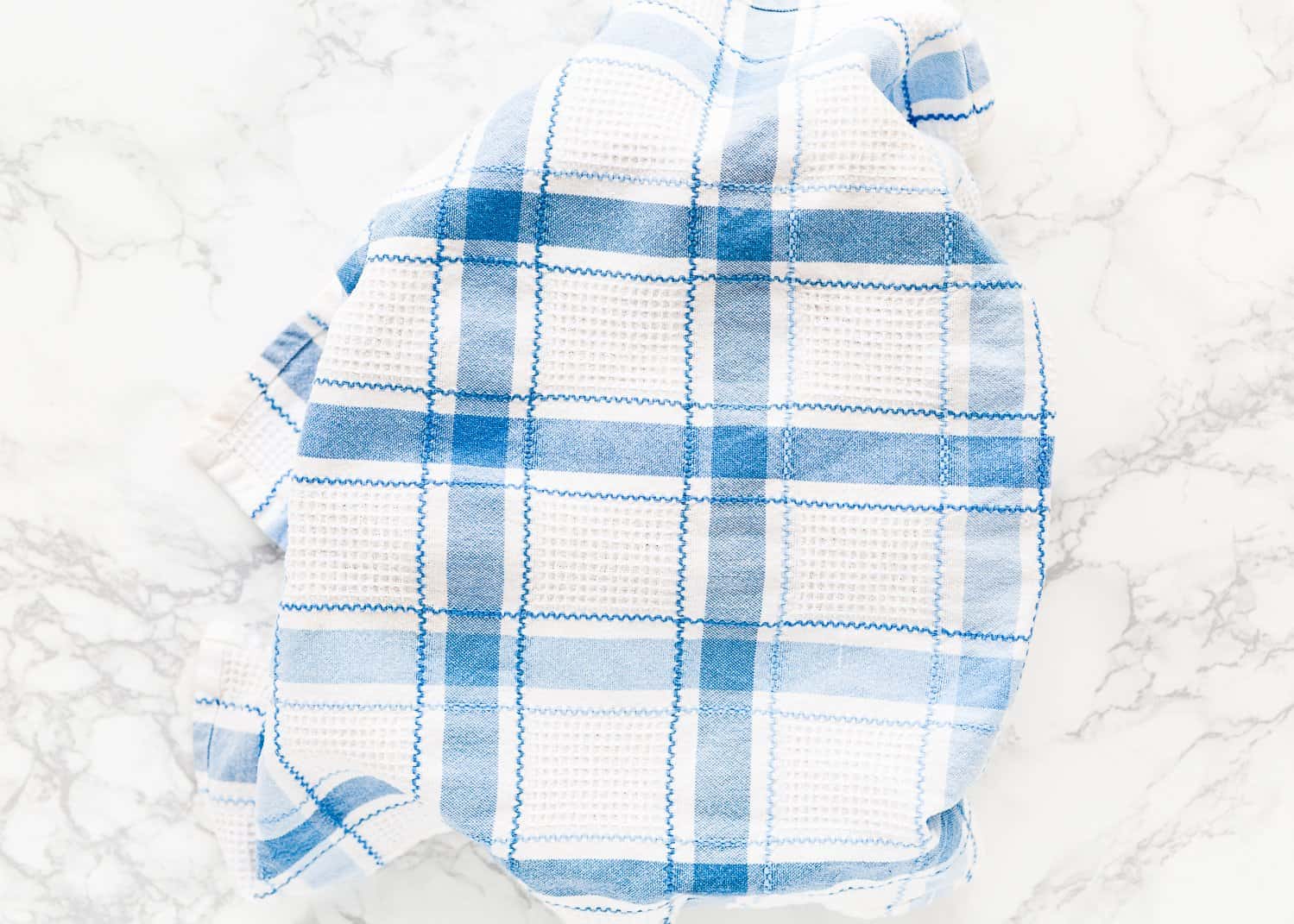 bundt cake pan covered with a kitchen towel. 