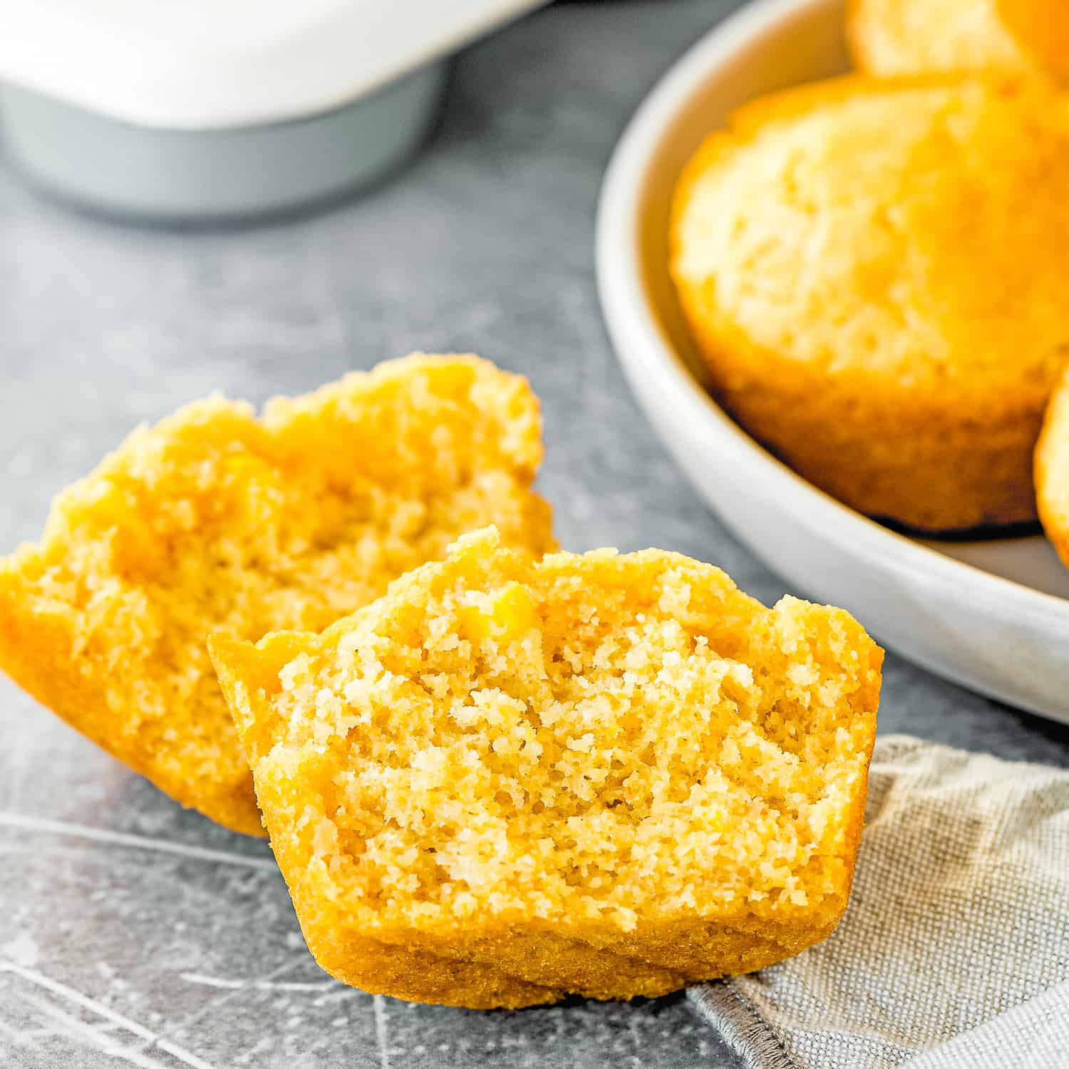 egg-free cornbread muffin cut open showing the inside texture
