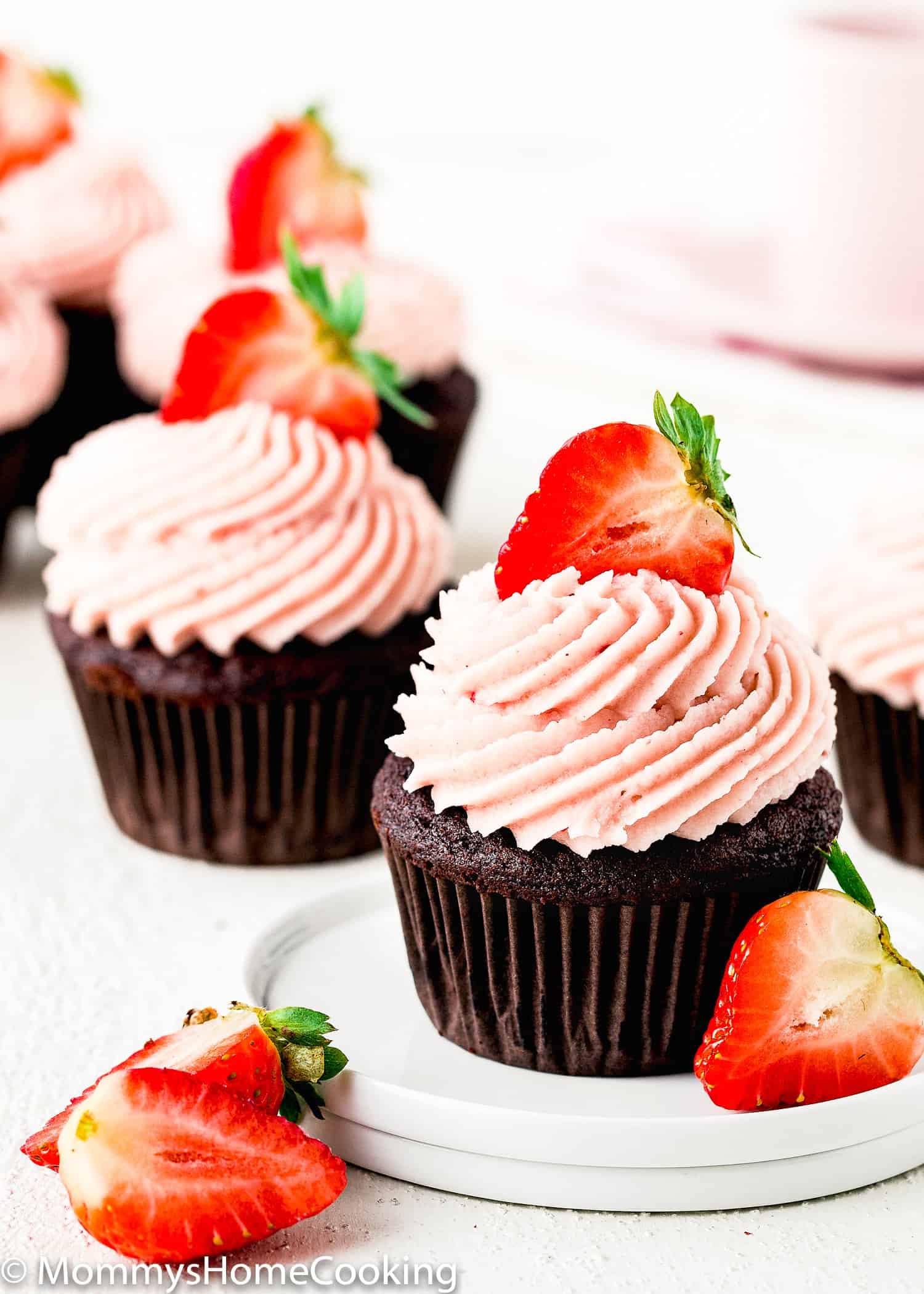 Eggless Chocolate Strawberry Cupcakes with fresh strawberries.