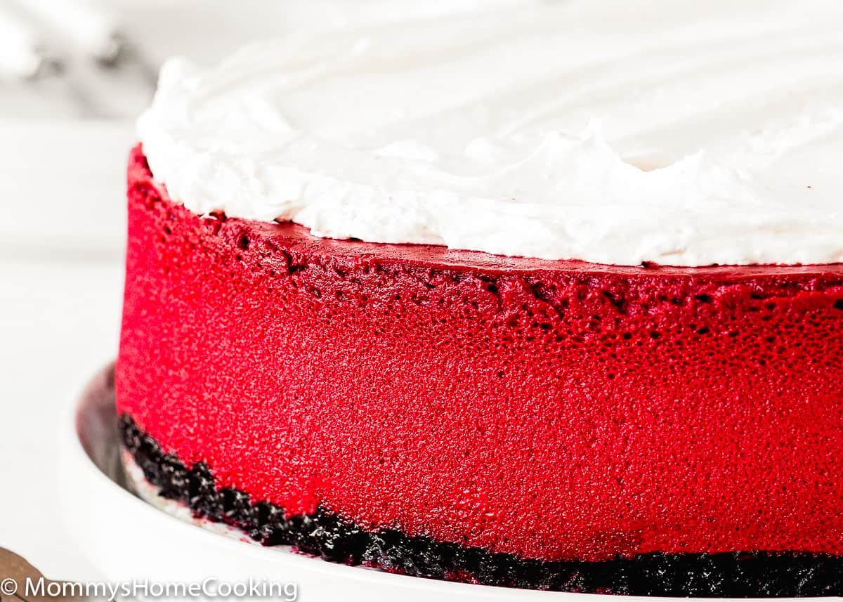 closeup of view of a eggless red velvet cheesecake on a plate.