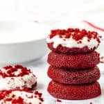Eggless Red Velvet Donuts stack with cream cheese glaze