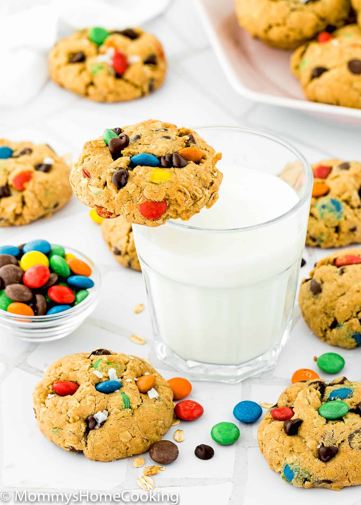 Eggless Monster Cookies with a glass of milk.