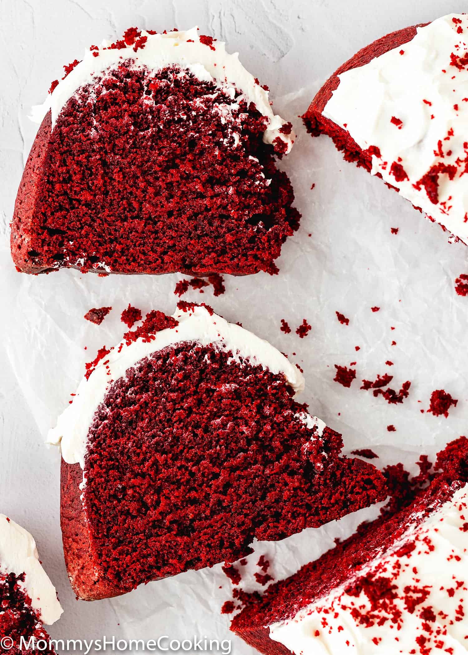 two slices of Eggless Red Velvet Bundt Cake showing inside fluffy texture.