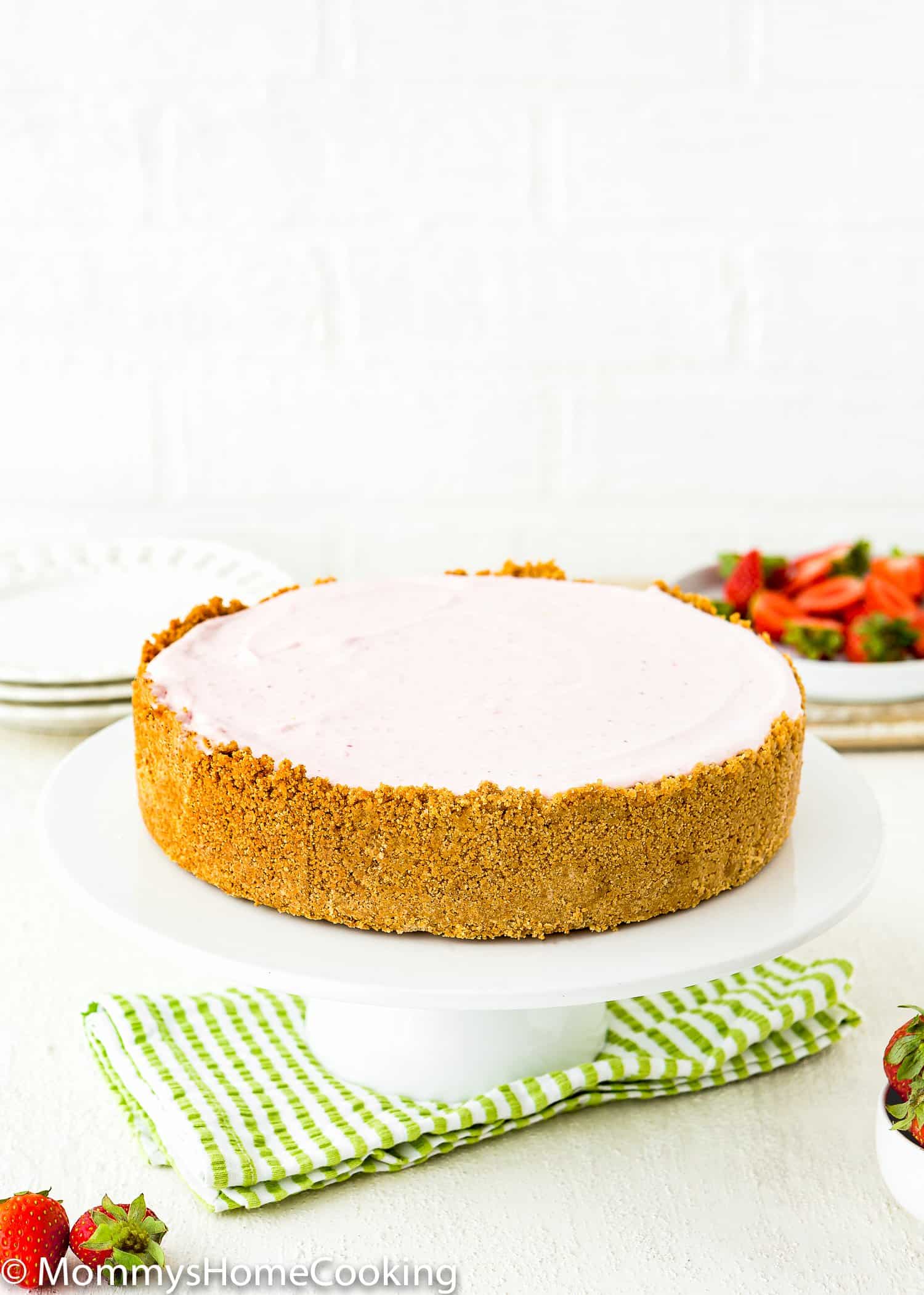 Homemade Easy Graham Cracker Crust on a cake stand.