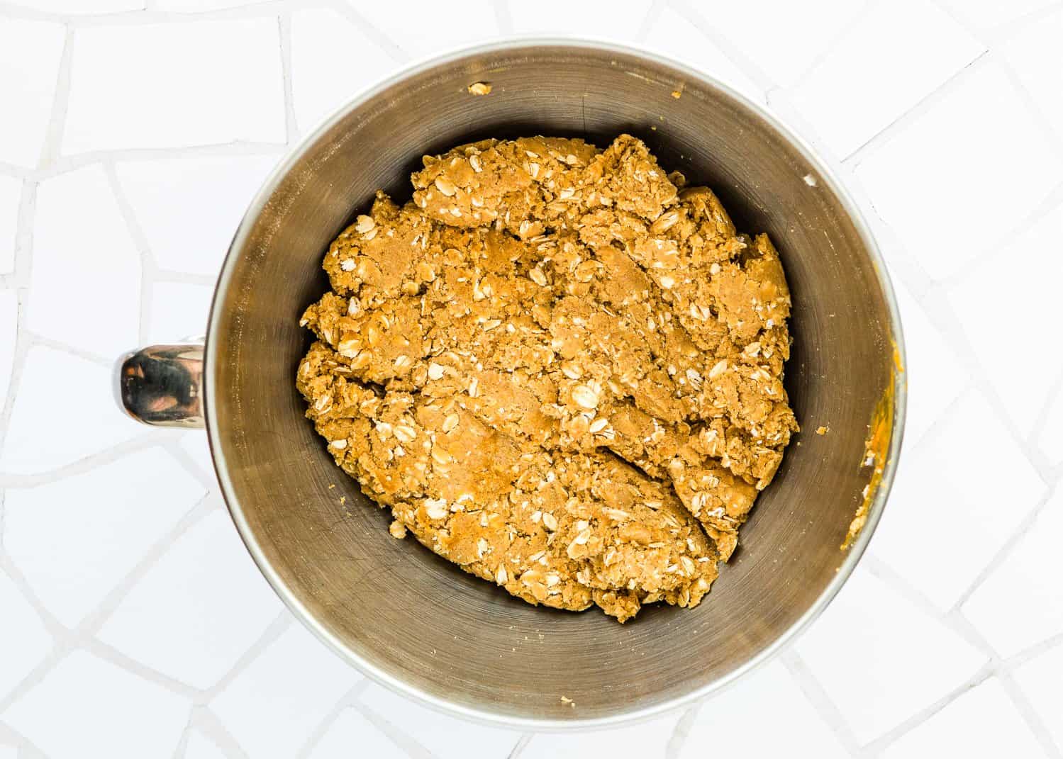 Eggless Monster Cookies dough in a stand mixer bowl. 