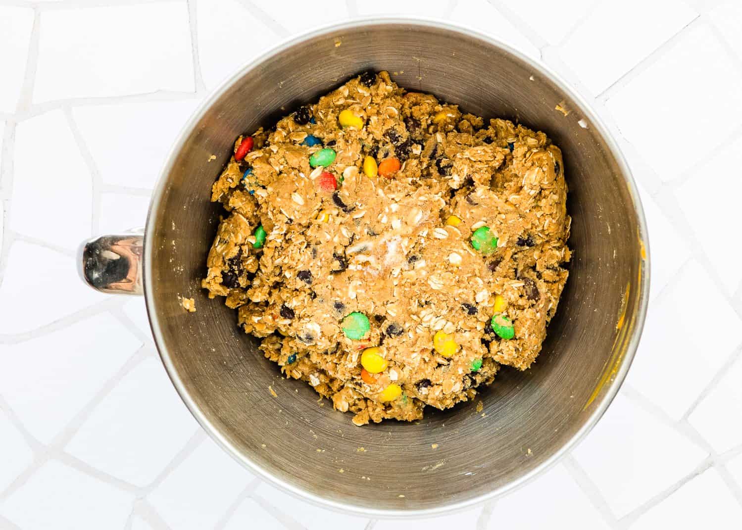 Eggless Monster Cookies dough in a bowl. 