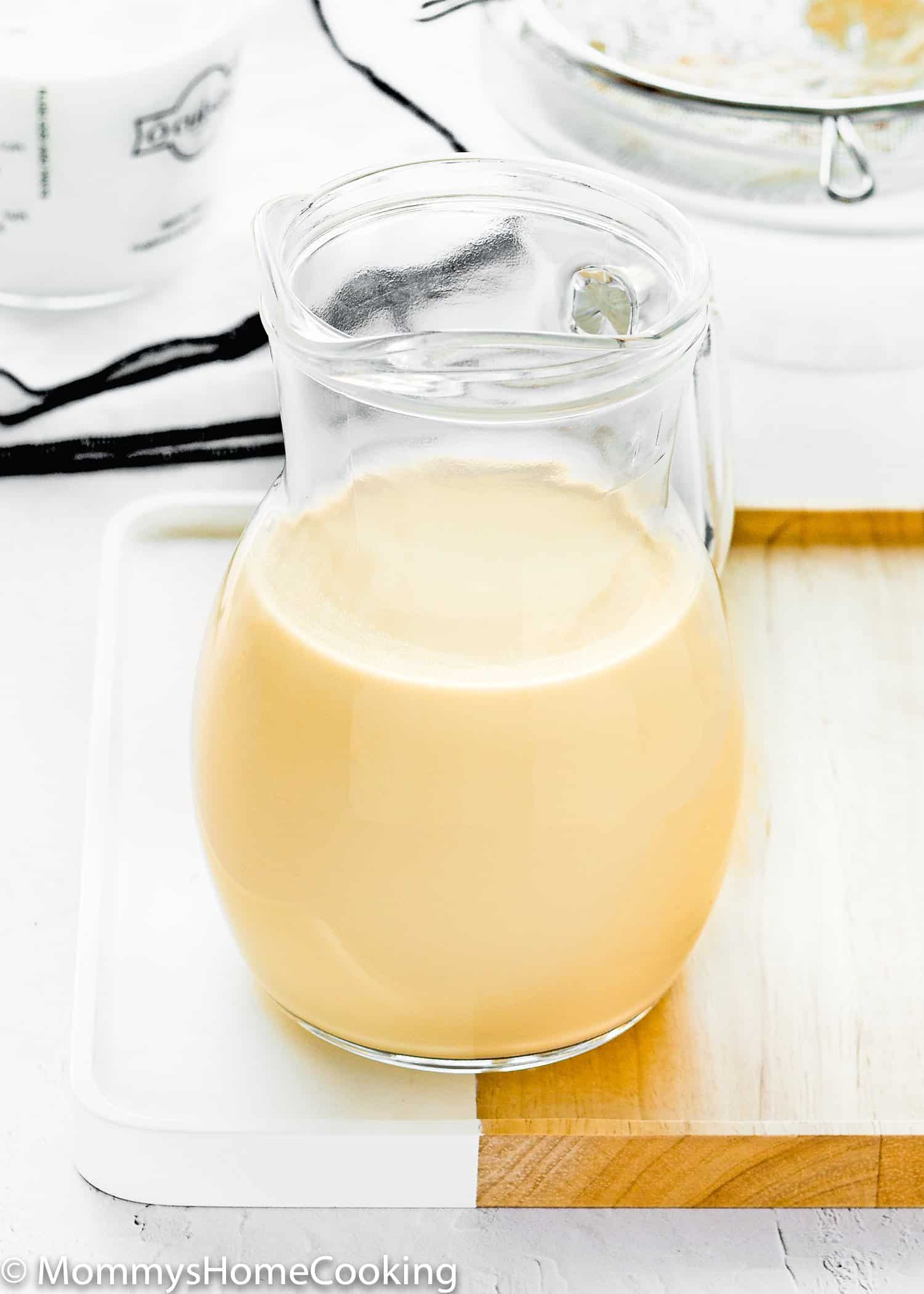 Homemade evaporated milk in a jar.