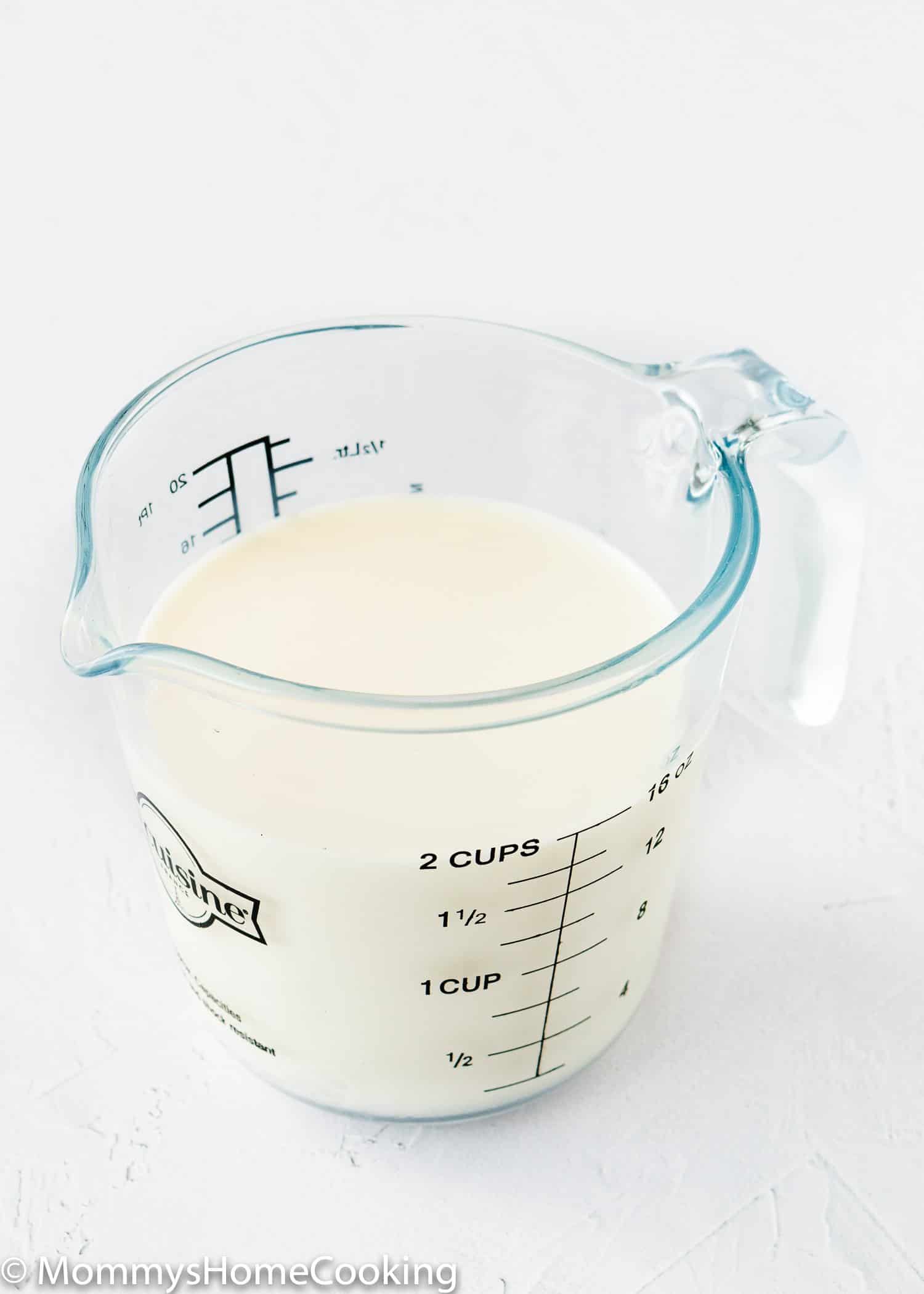 whole milk in a measuring cup.