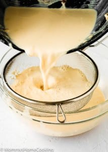 evaporated milk being strained