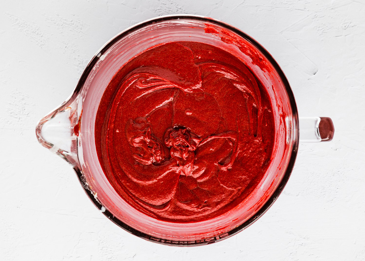 Eggless Red Velvet cupcake batter in a bowl. 