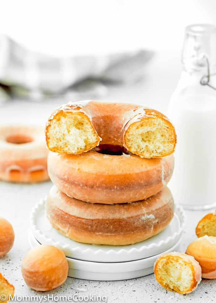 a stack of eggless fluffy donuts in a plate