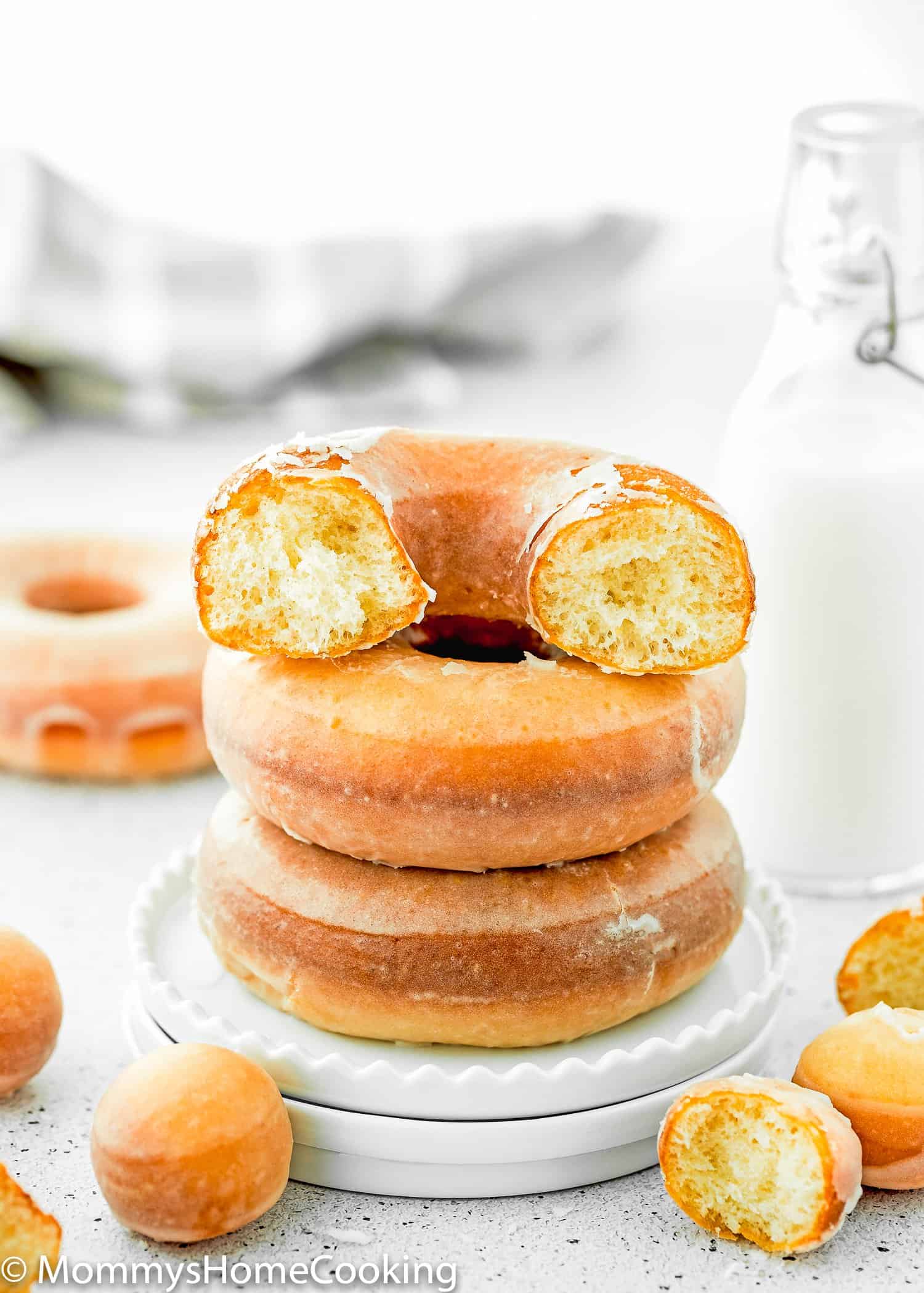 a stack of eggless fluffy donuts in a plate.