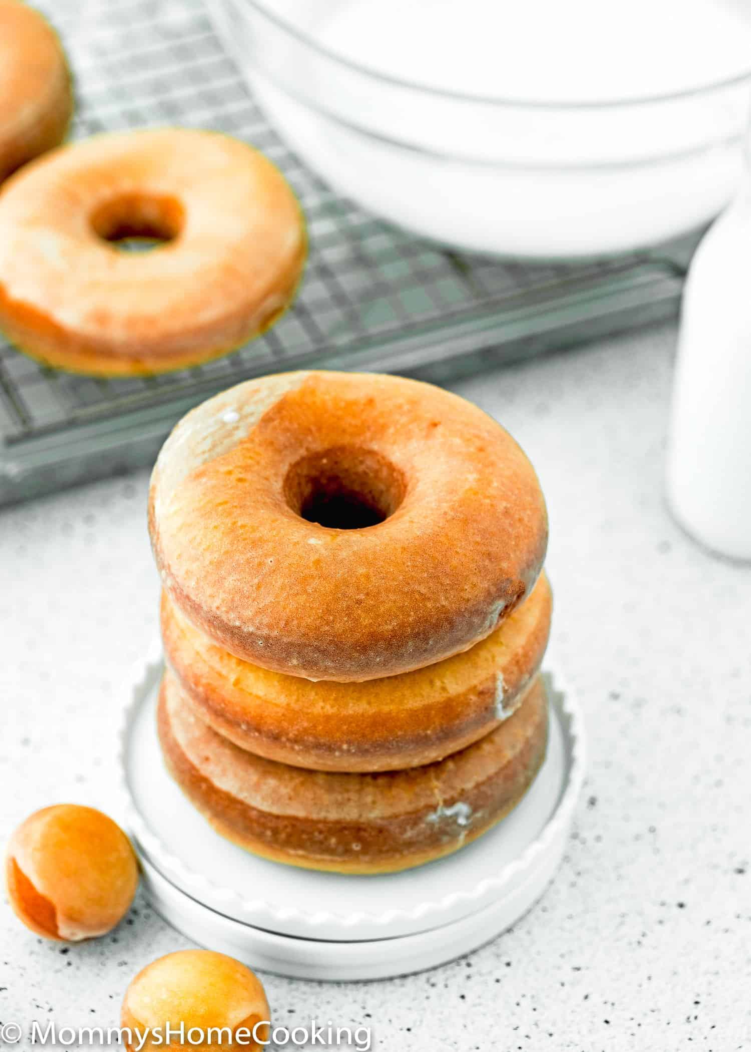 a stack of eggless donuts in a plate. 