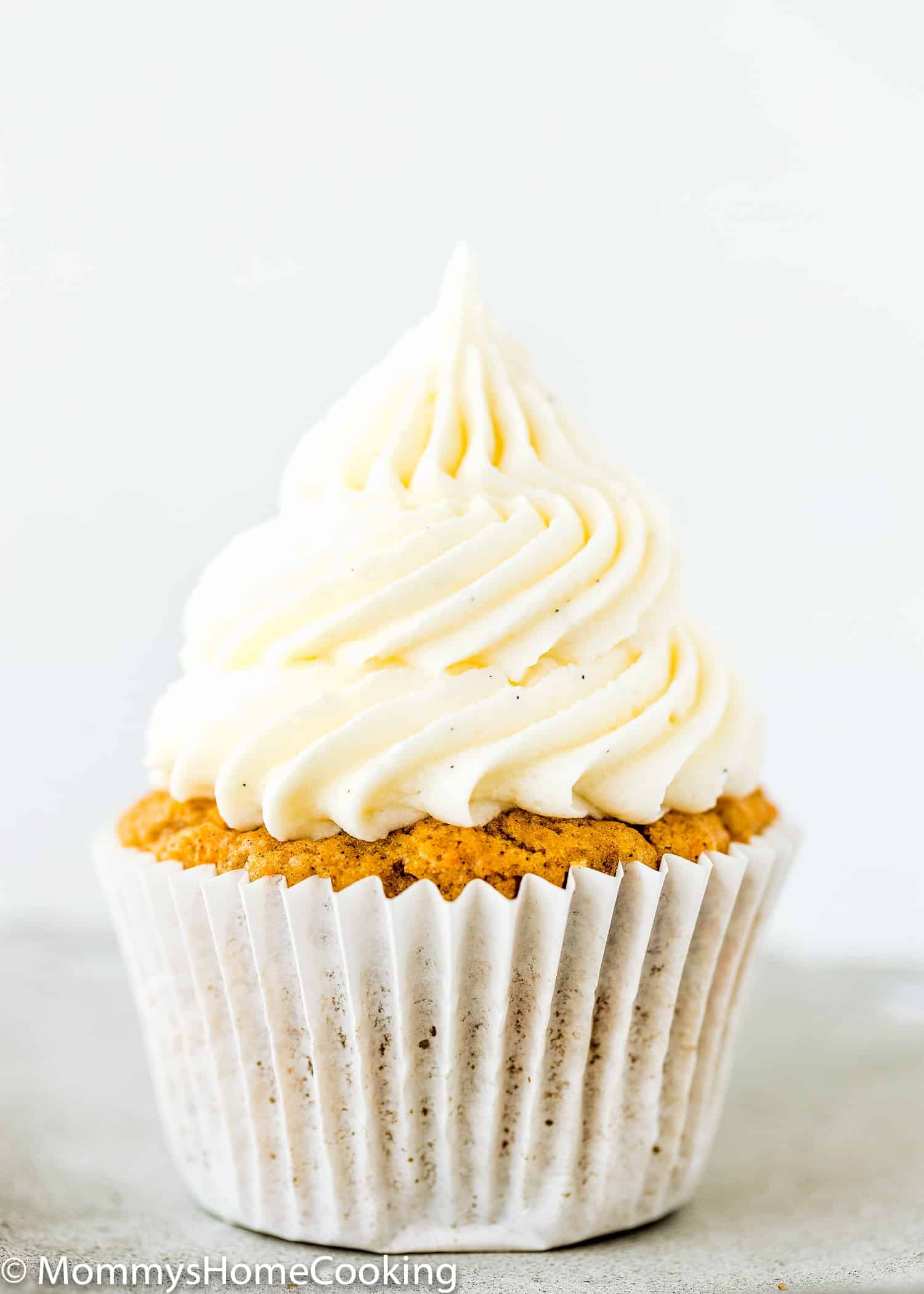 Eggless carrot cupcake frosted with cream cheese frosting.