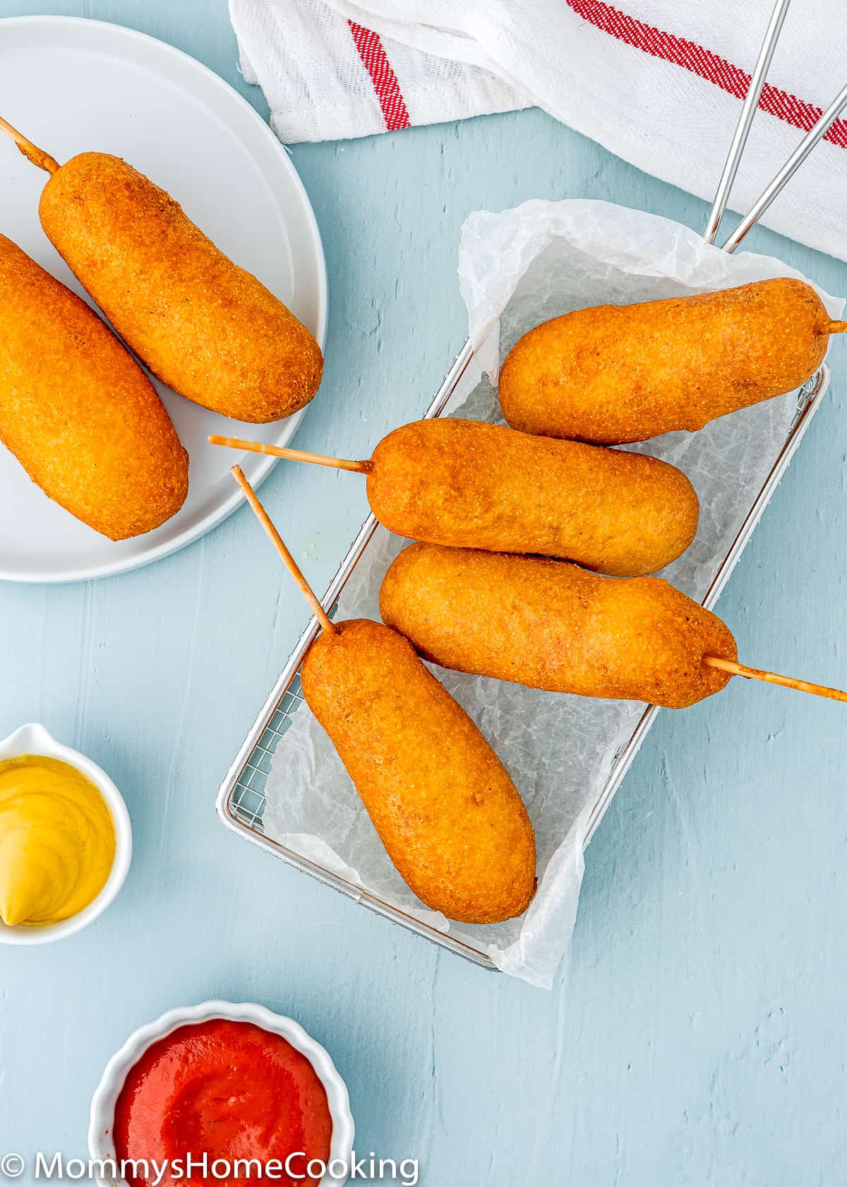 eggless homemade corndogs in a frying basket.