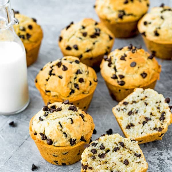 Eggless Bakery-Style Chocolate Chip Muffins with a bottle of milk