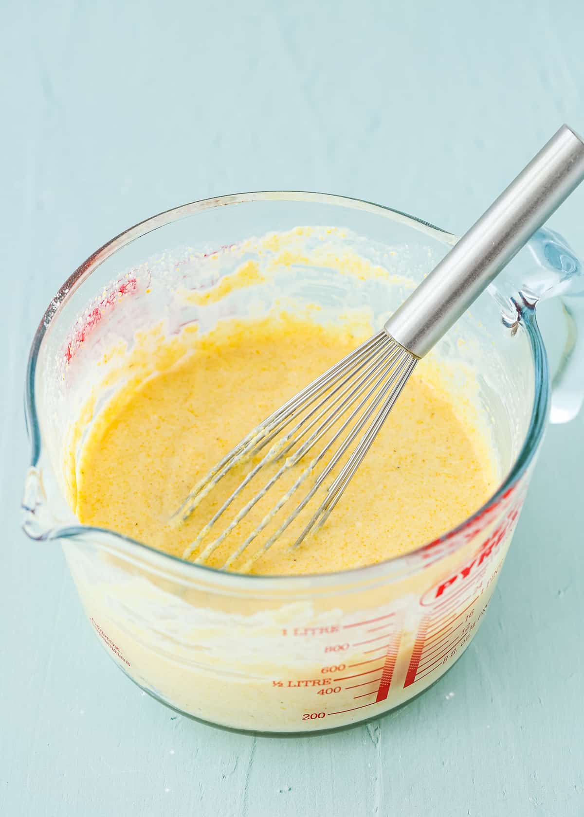 corndog batter in a glass measuring cup.