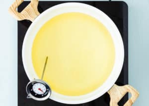 oil in a large pot with a frying thermometer