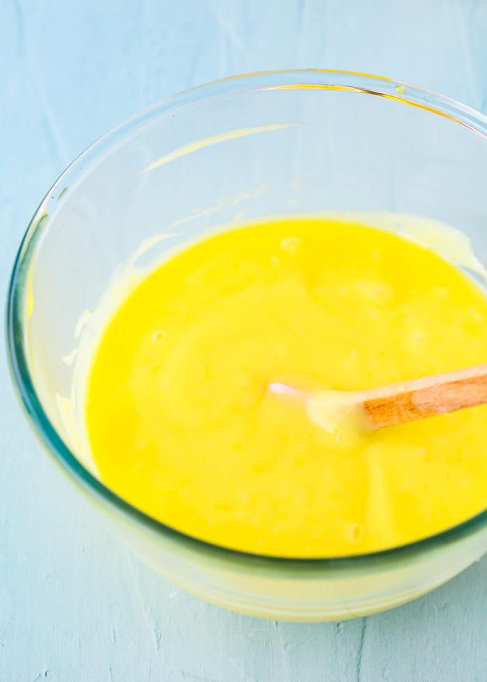 egg-free lemon curd in a bowl with a spatula. 