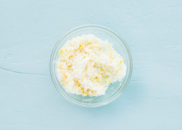 sugar and lemon zest in a bowl mixed together. 